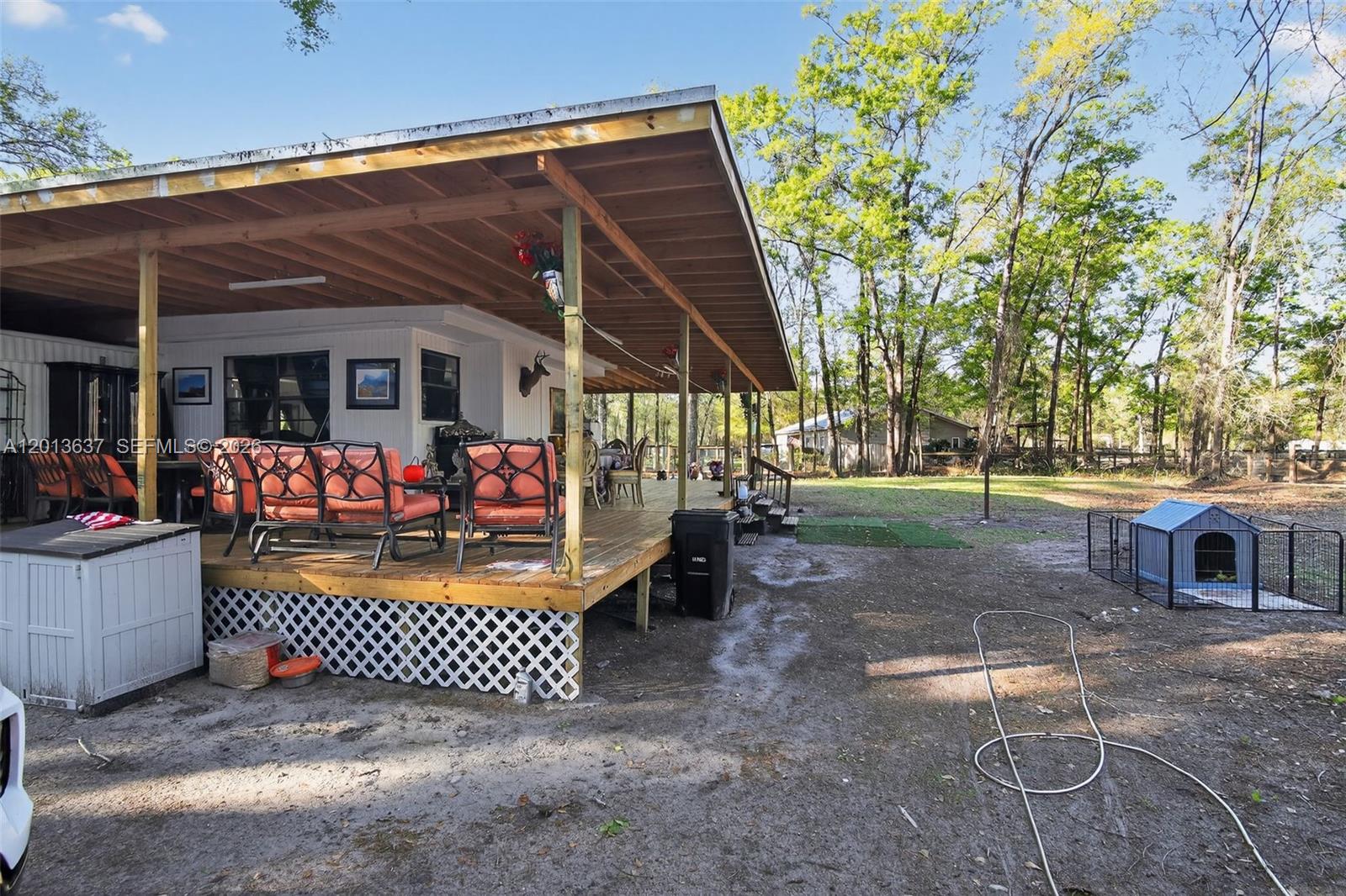 2522 Northwest 121st Avenue Gainesville, FL 32609 - Photo 22 of 40 a view of a chairs and tables in the patio