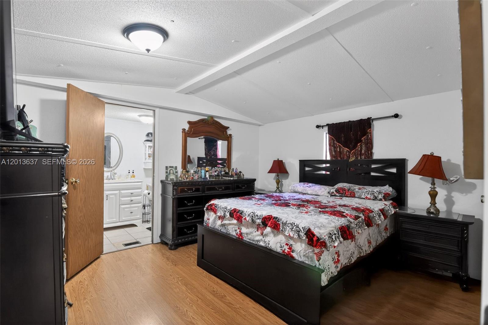 2522 Northwest 121st Avenue Gainesville, FL 32609 - Photo 34 of 40 a bed room with a bed and furniture