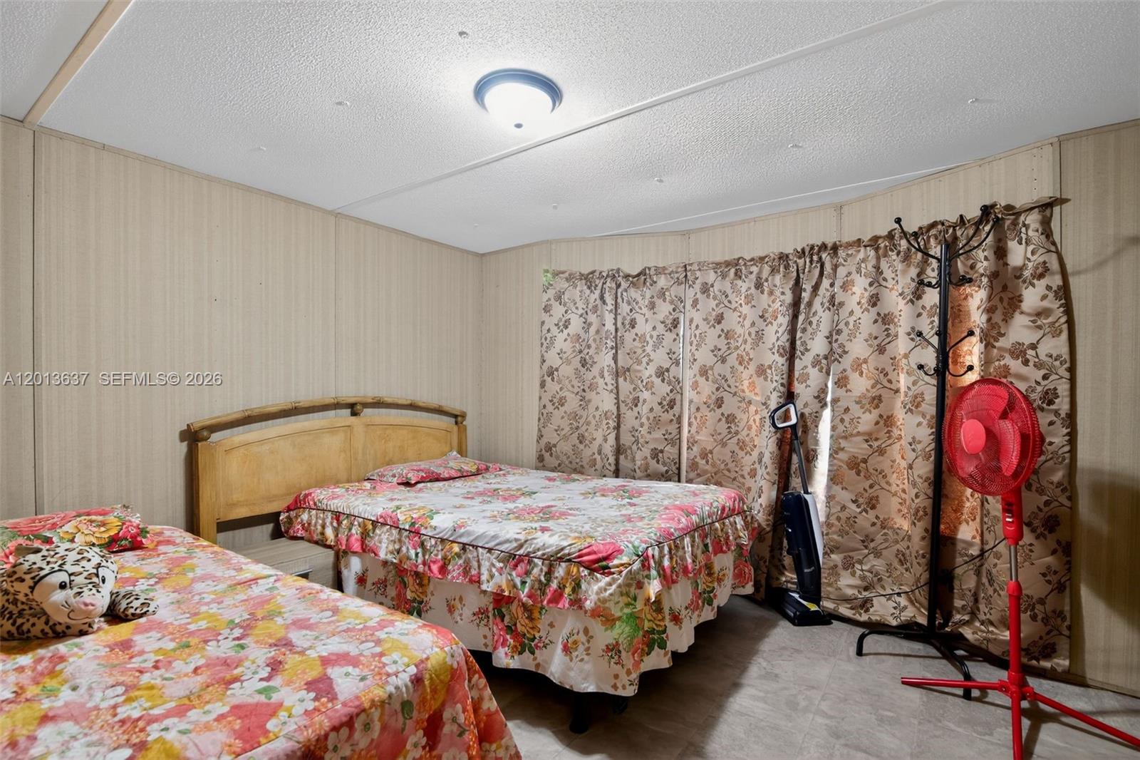 2522 Northwest 121st Avenue Gainesville, FL 32609 - Photo 36 of 40 a bedroom with two beds and painted walls