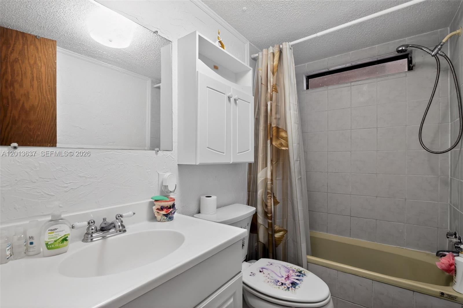 2522 Northwest 121st Avenue Gainesville, FL 32609 - Photo 37 of 40 a bathroom with a sink a toilet and shower