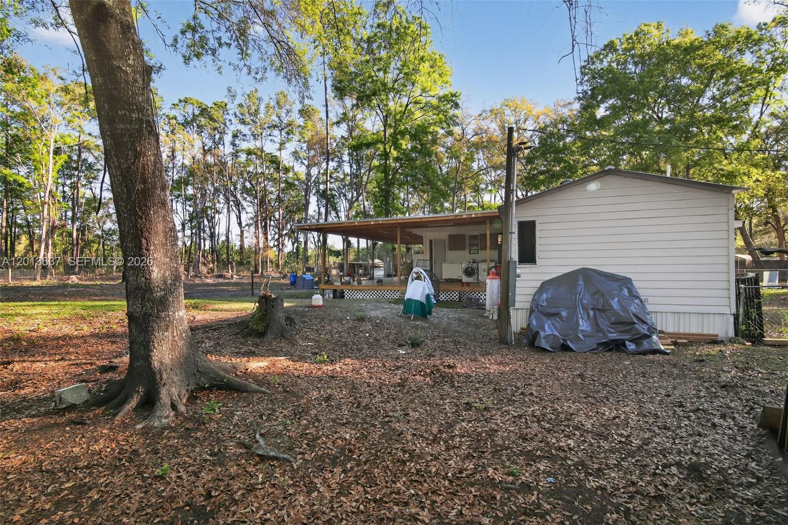 2522 Northwest 121st Avenue Gainesville, FL 32609 - Photo 4 of 40 a view of a house with backyard and sitting area