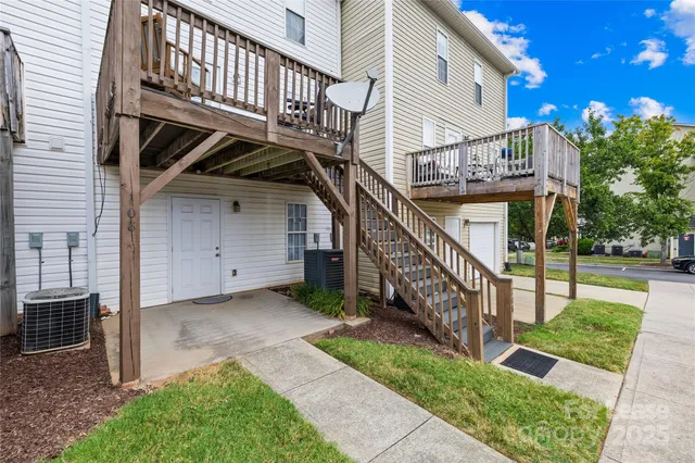 a view of backyard with deck and deck