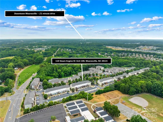a view of a swimming pool with a patio and a yard