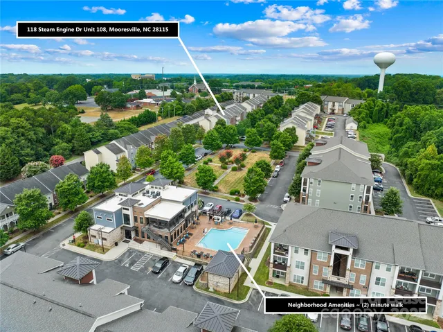 an aerial view of a house with garden space and street view