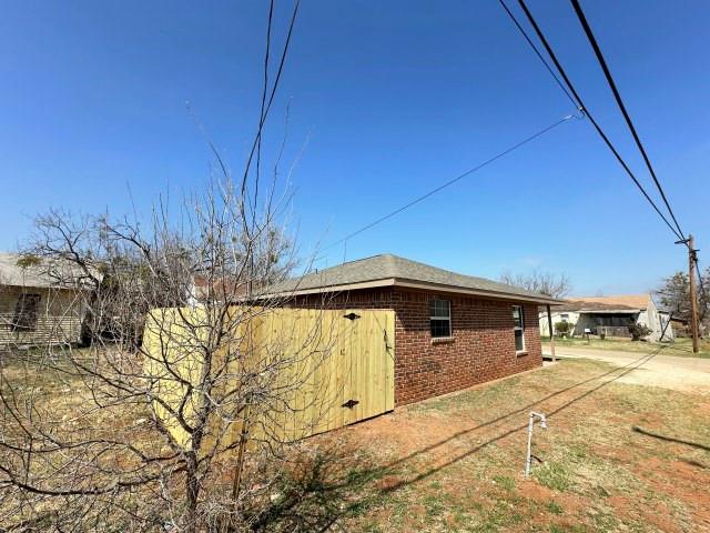1107 North 4th Street Merkel, TX 79536 - Photo 2 of 16 a front view of a house with a yard