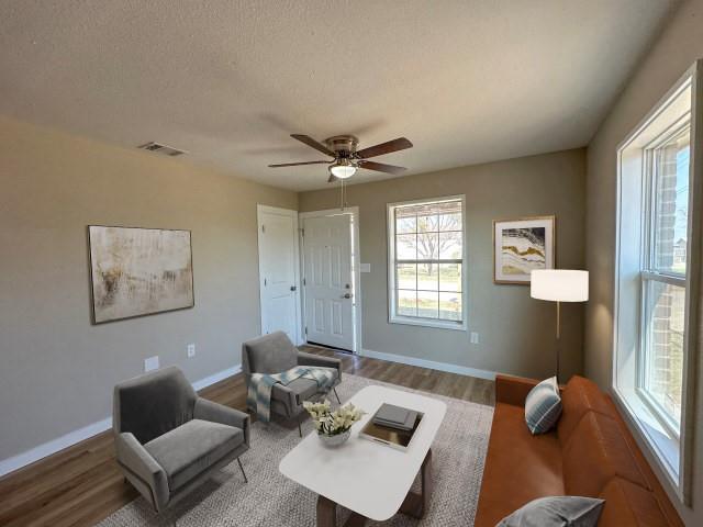 1107 North 4th Street Merkel, TX 79536 - Photo 5 of 16 a living room with furniture and a window
