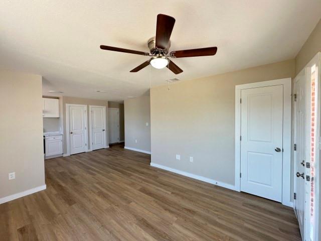 1107 North 4th Street Merkel, TX 79536 - Photo 6 of 16 a view of empty room with wooden floor