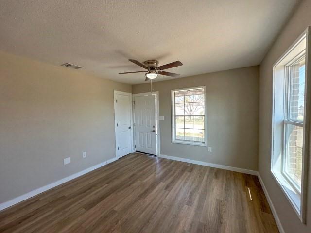 1107 North 4th Street Merkel, TX 79536 - Photo 7 of 16 a view of an empty room with a window