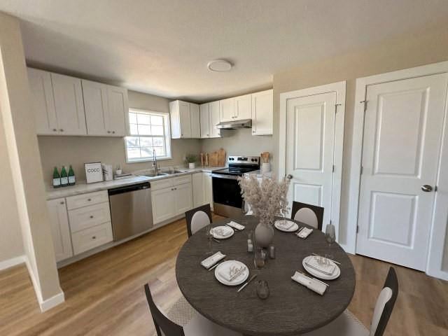 1107 North 4th Street Merkel, TX 79536 - Photo 8 of 16 a open dining room with furniture and wooden floor