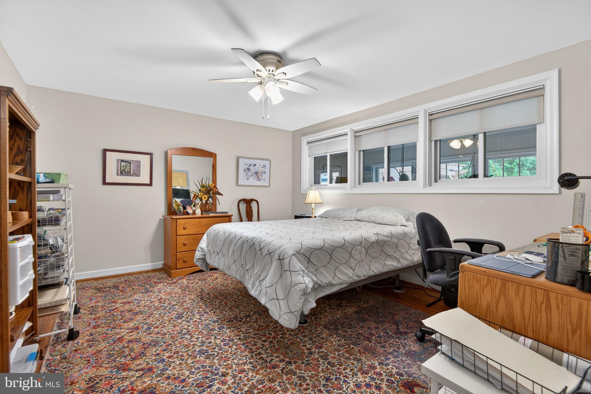 102 East Third Avenue Lititz, PA 17543 - Photo 14 of 45 a spacious bedroom with a bed a desk and chair