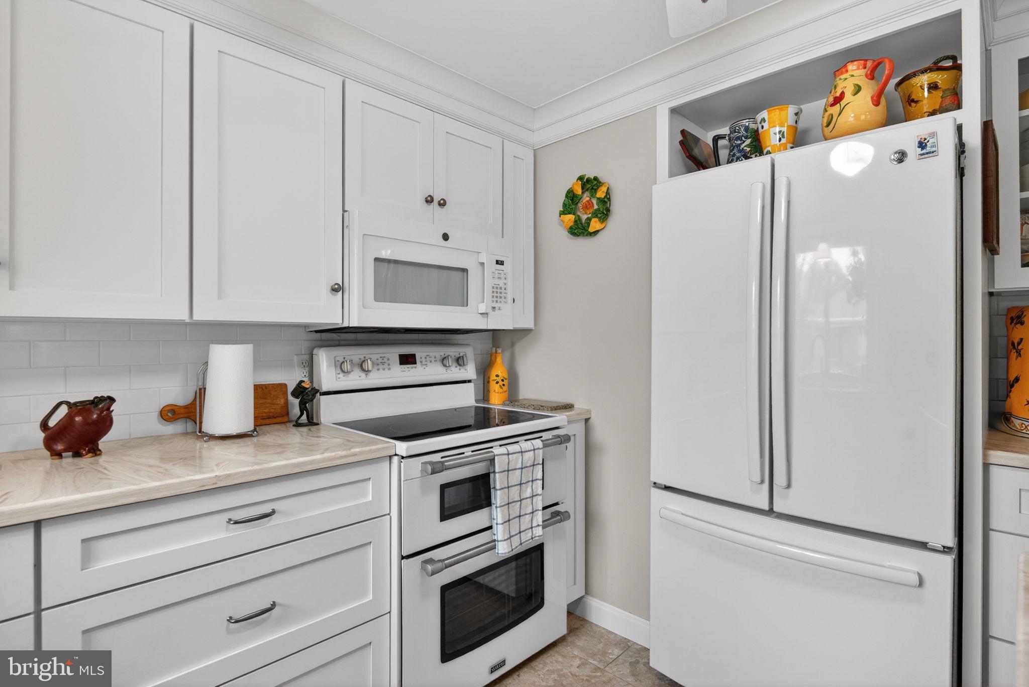 102 East Third Avenue Lititz, PA 17543 - Photo 16 of 45 a white refrigerator freezer sitting in a kitchen