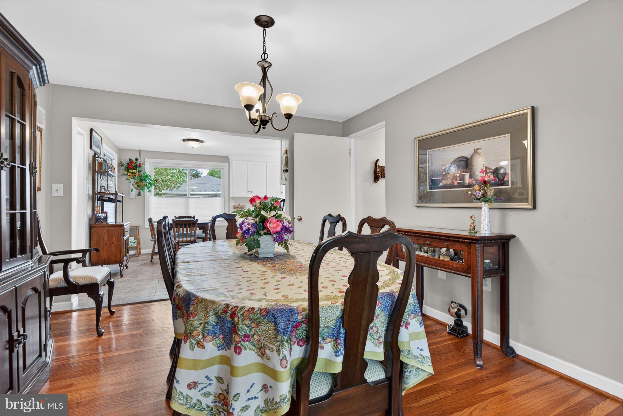 102 East Third Avenue Lititz, PA 17543 - Photo 18 of 45 a view of a dining room with furniture wooden floor and chandelier