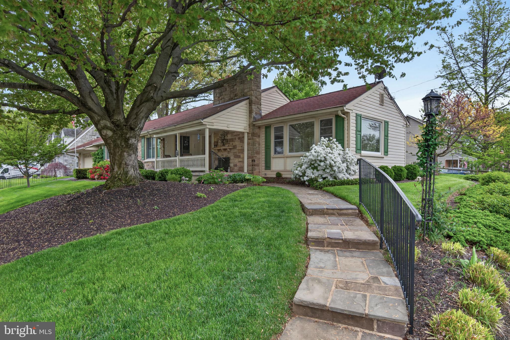 102 East Third Avenue Lititz, PA 17543 - Photo 2 of 45 a front view of a house with a yard and trees