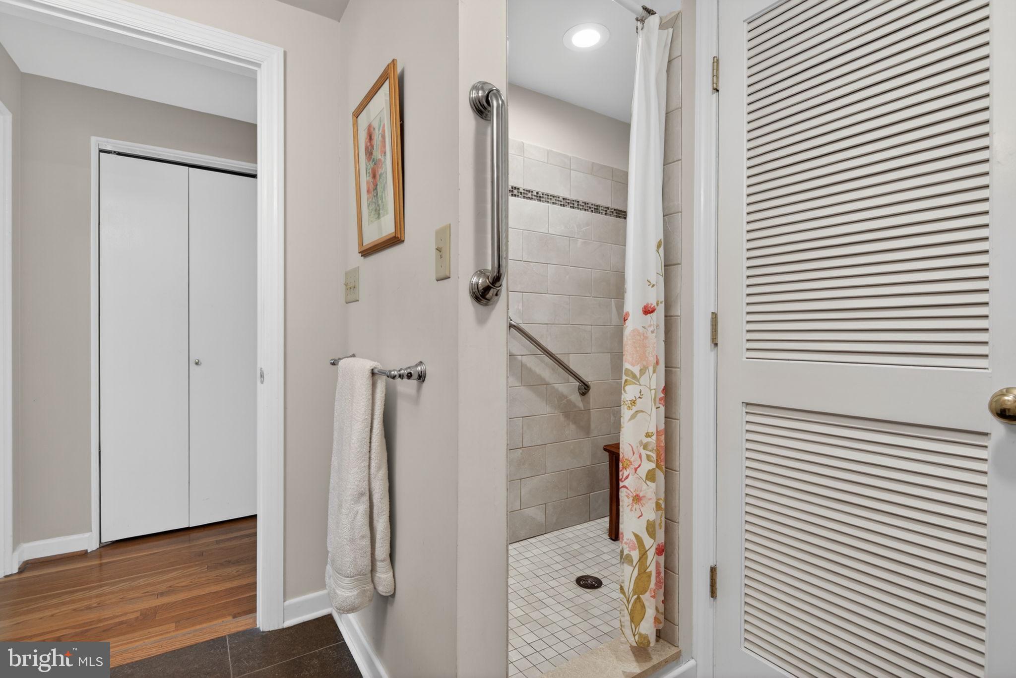 102 East Third Avenue Lititz, PA 17543 - Photo 33 of 45 a bathroom with a glass shower door and a mirror