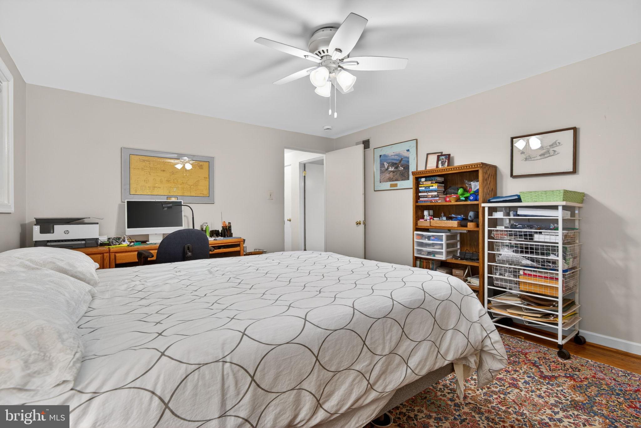 102 East Third Avenue Lititz, PA 17543 - Photo 34 of 45 a bedroom with a bed and a chandelier