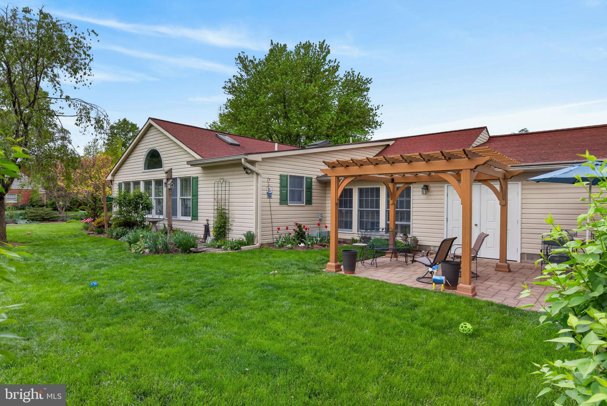 102 East Third Avenue Lititz, PA 17543 - Photo 41 of 45 a front view of a house with a garden and patio