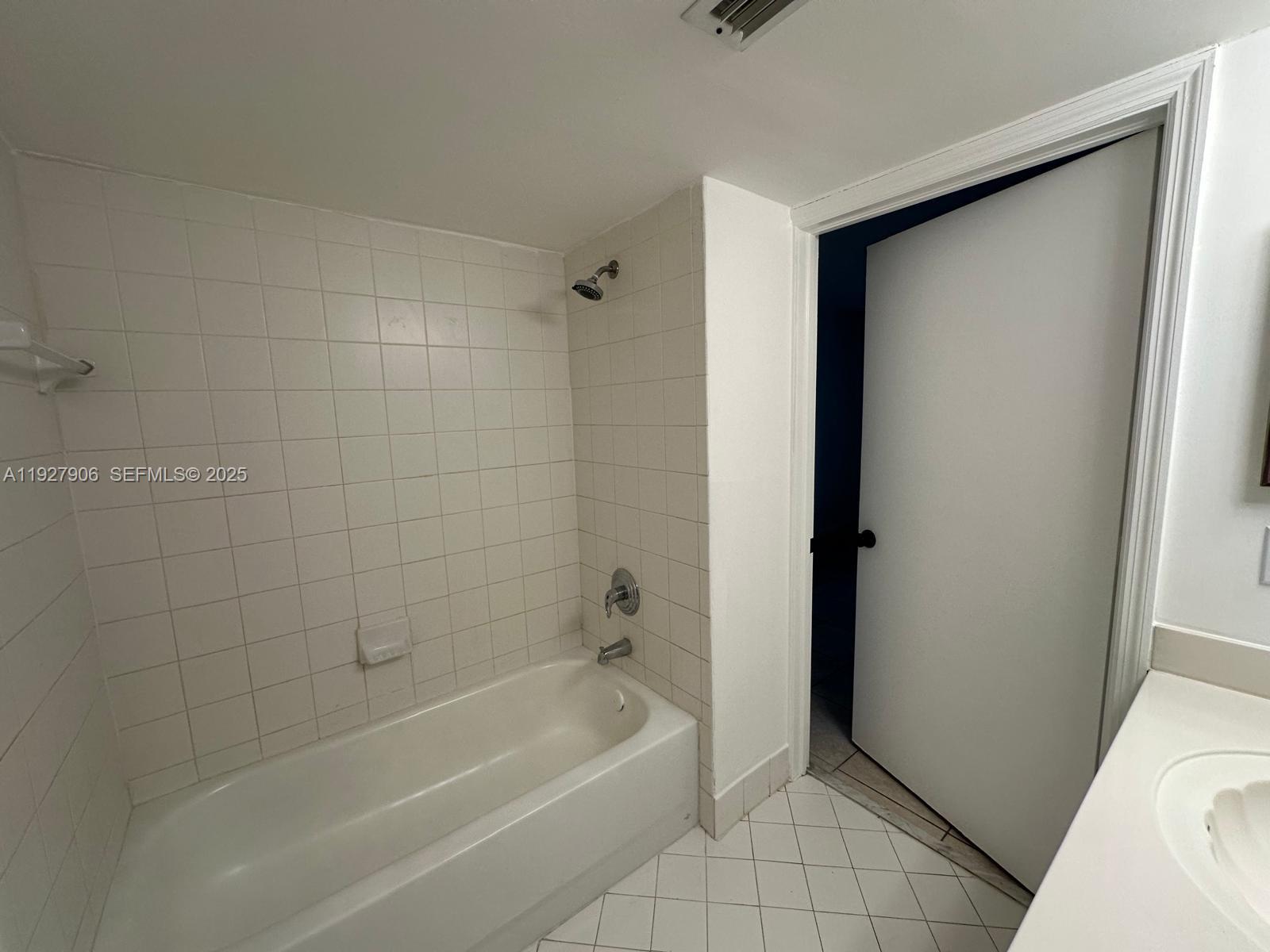 2911 Southeast 13th Road, Unit 10140 Homestead, FL 33035 - Photo 15 of 22 a bathroom with a bathtub and a shower