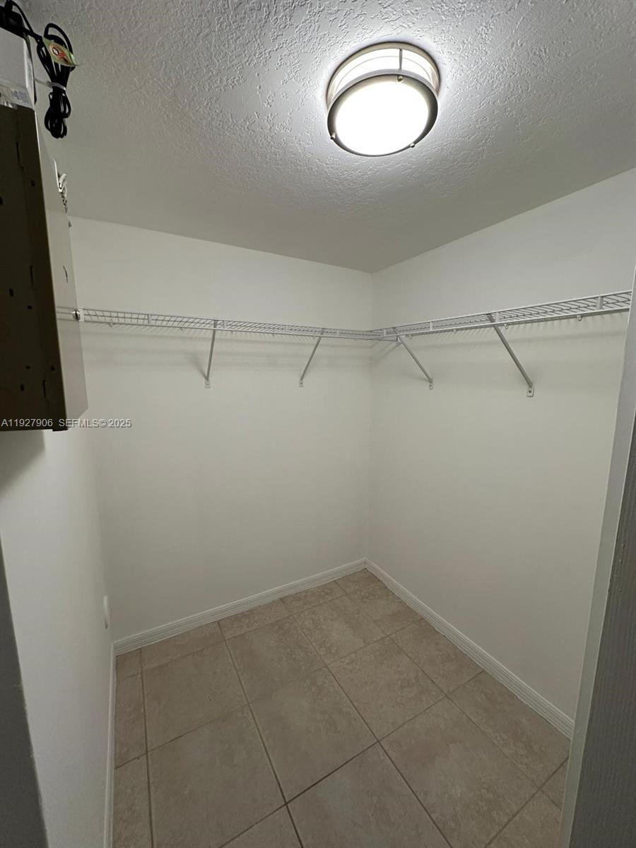 2911 Southeast 13th Road, Unit 10140 Homestead, FL 33035 - Photo 16 of 22 a view of a room with racks on the wall