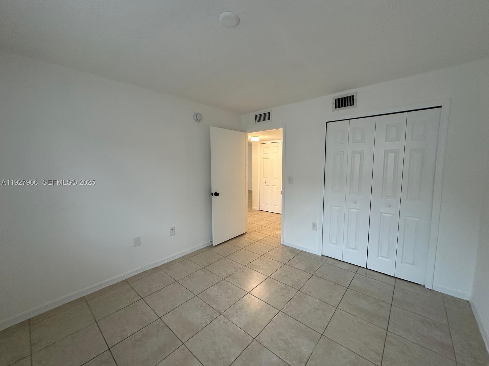 2911 Southeast 13th Road, Unit 10140 Homestead, FL 33035 - Photo 19 of 22 a view of an empty room