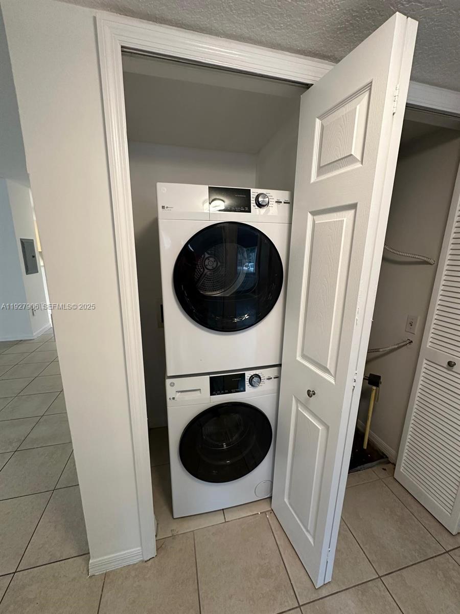 2911 Southeast 13th Road, Unit 10140 Homestead, FL 33035 - Photo 22 of 22 a utility room with dryer and washer
