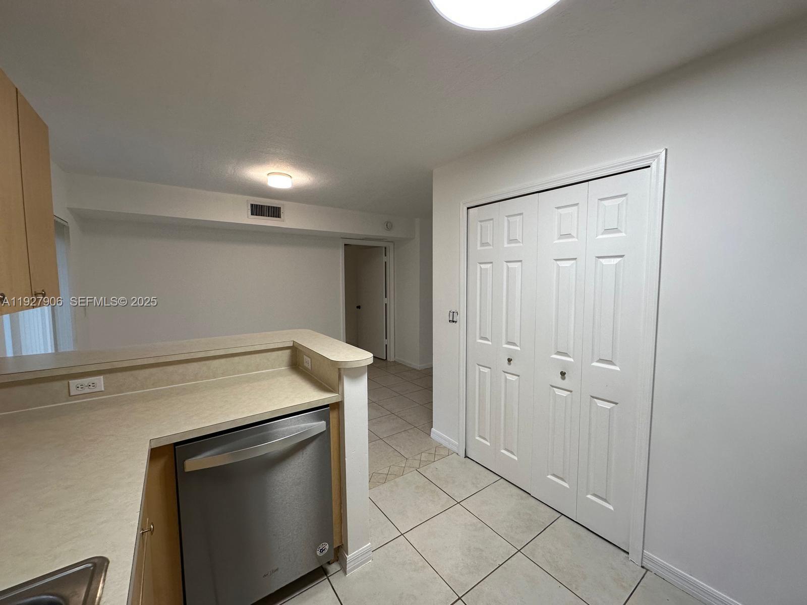 2911 Southeast 13th Road, Unit 10140 Homestead, FL 33035 - Photo 6 of 22 a utility room with cabinets