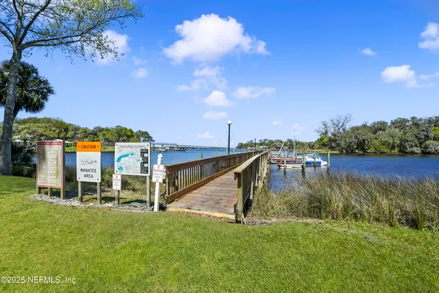 a view of a lake with a house in the background