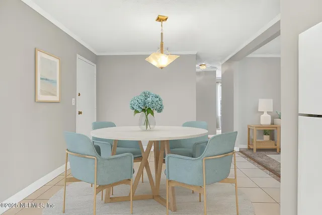 a dining room with furniture and chandelier