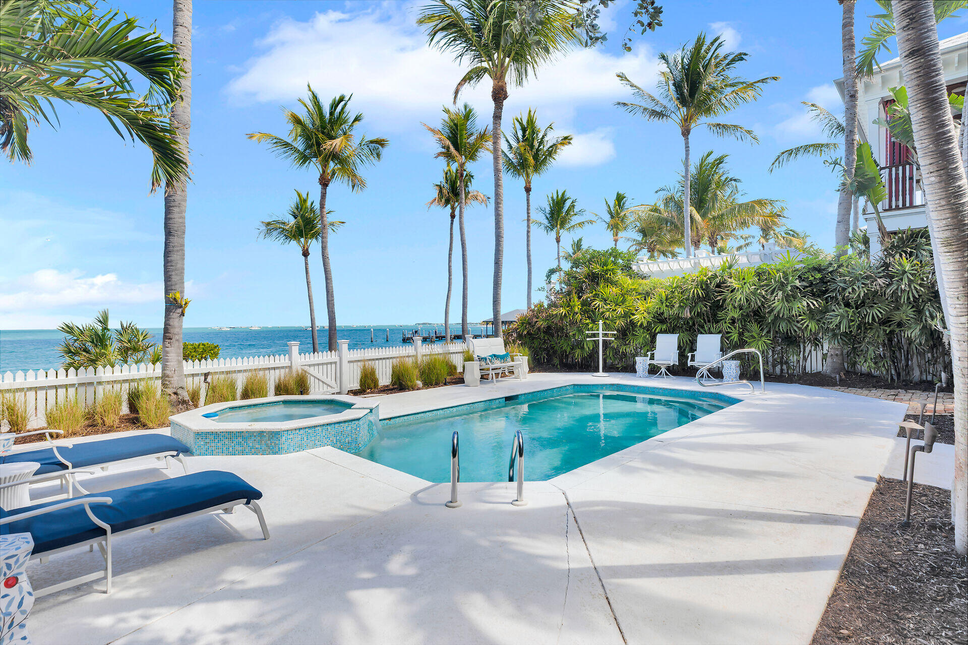 a view of swimming pool with outdoor seating and a patio