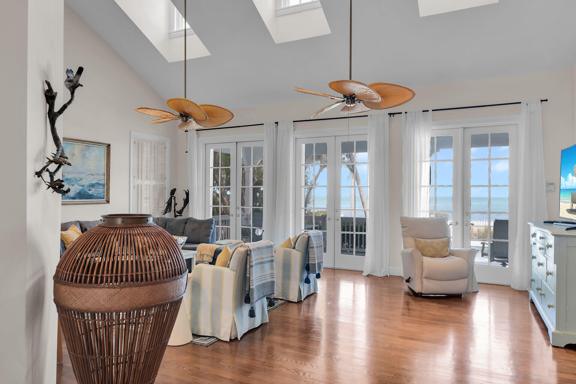 5 Sunset Key Drive Key West, FL 33040 - Photo 13 of 47 a living room with furniture a chandelier and a window
