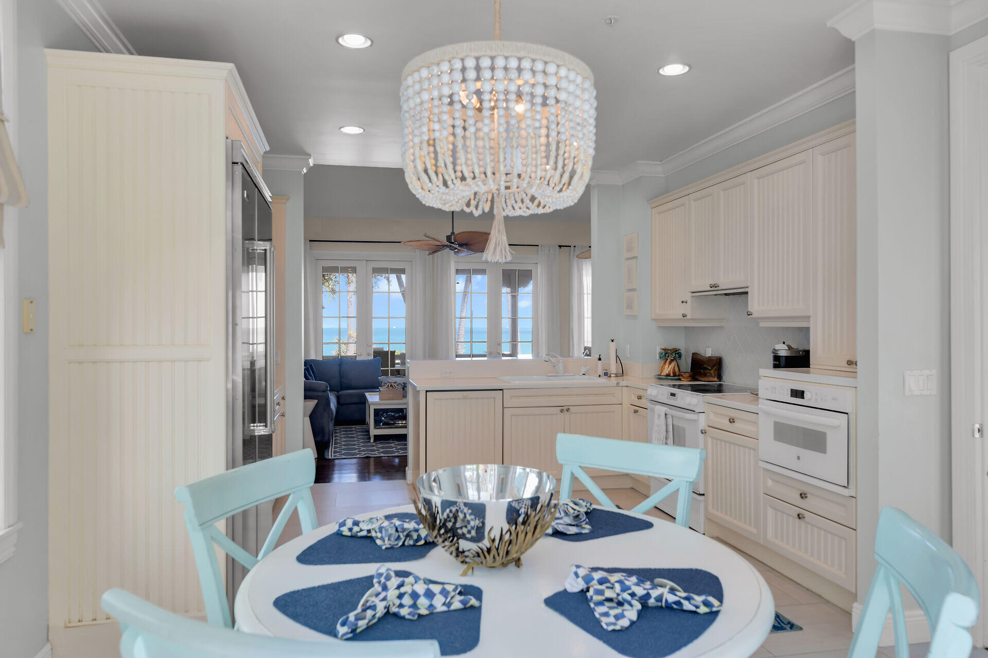 5 Sunset Key Drive Key West, FL 33040 - Photo 18 of 47 a kitchen with granite countertop a sink dining table and chairs