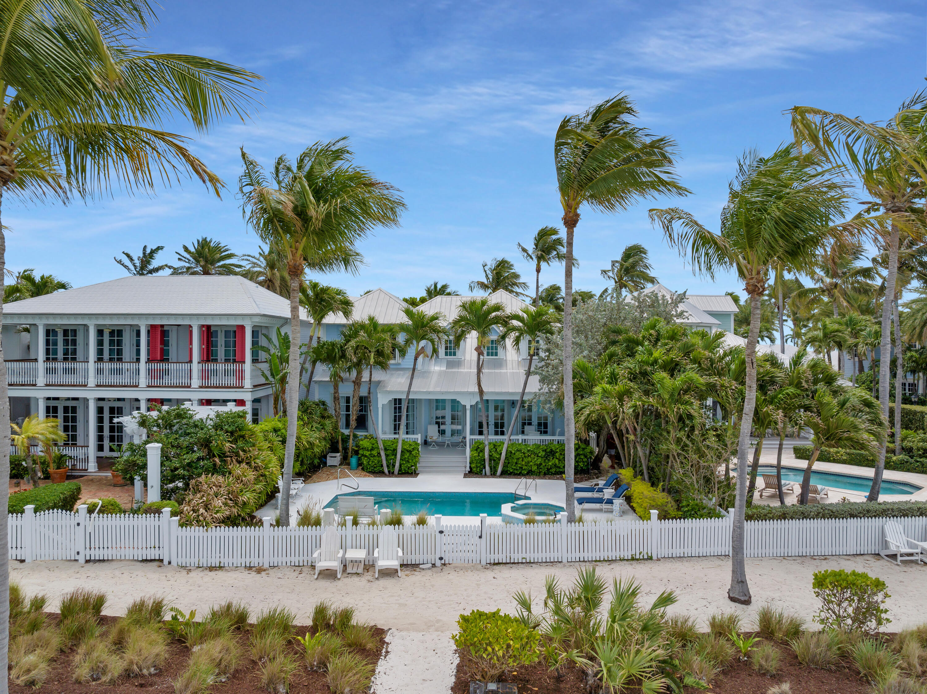5 Sunset Key Drive Key West, FL 33040 - Photo 2 of 47 a front view of a house with a garden
