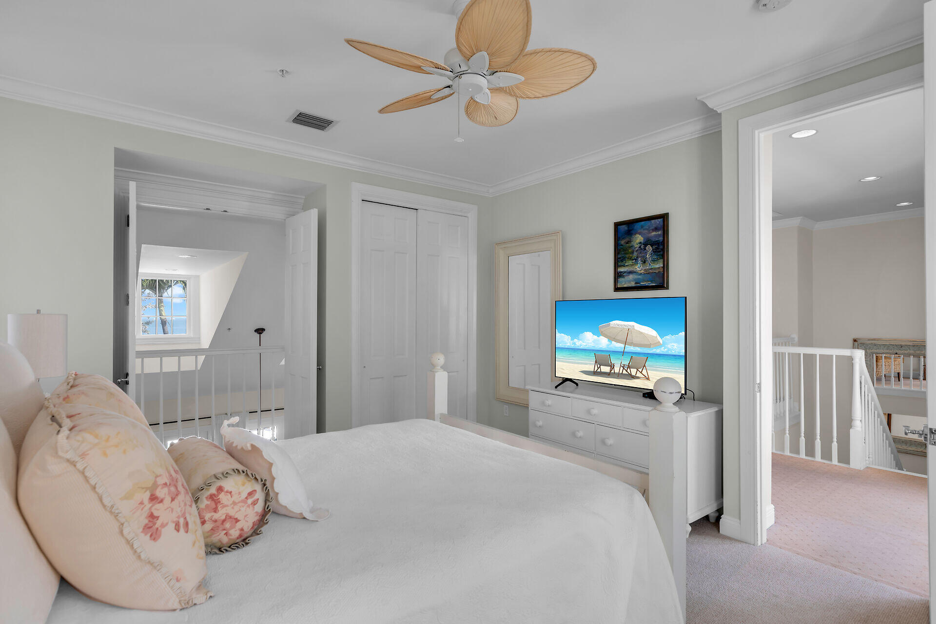 5 Sunset Key Drive Key West, FL 33040 - Photo 32 of 47 a bedroom with a bed a television and a large mirror