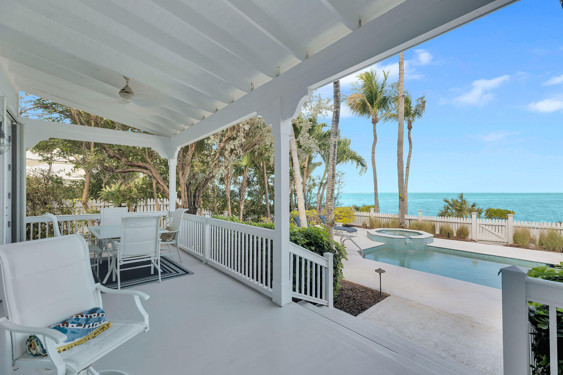 5 Sunset Key Drive Key West, FL 33040 - Photo 8 of 47 a living room with furniture and a floor to ceiling window