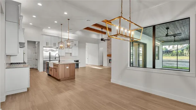 a kitchen with a sink and cabinets