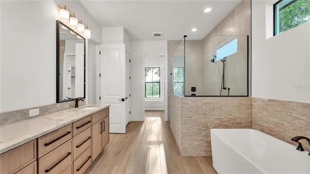 a bathroom with a sink a mirror and vanity