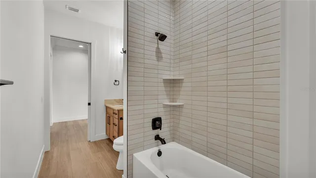 a view of an entryway with wooden floor and windows