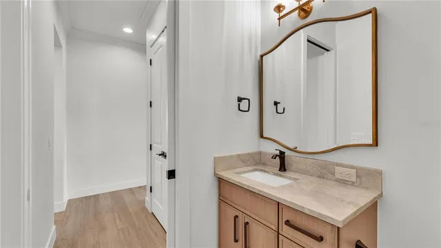 an empty room with window and ceiling fan