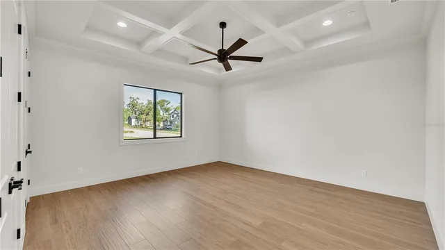 a view of an empty room with windows