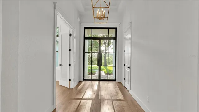 a view of an entryway with wooden floor