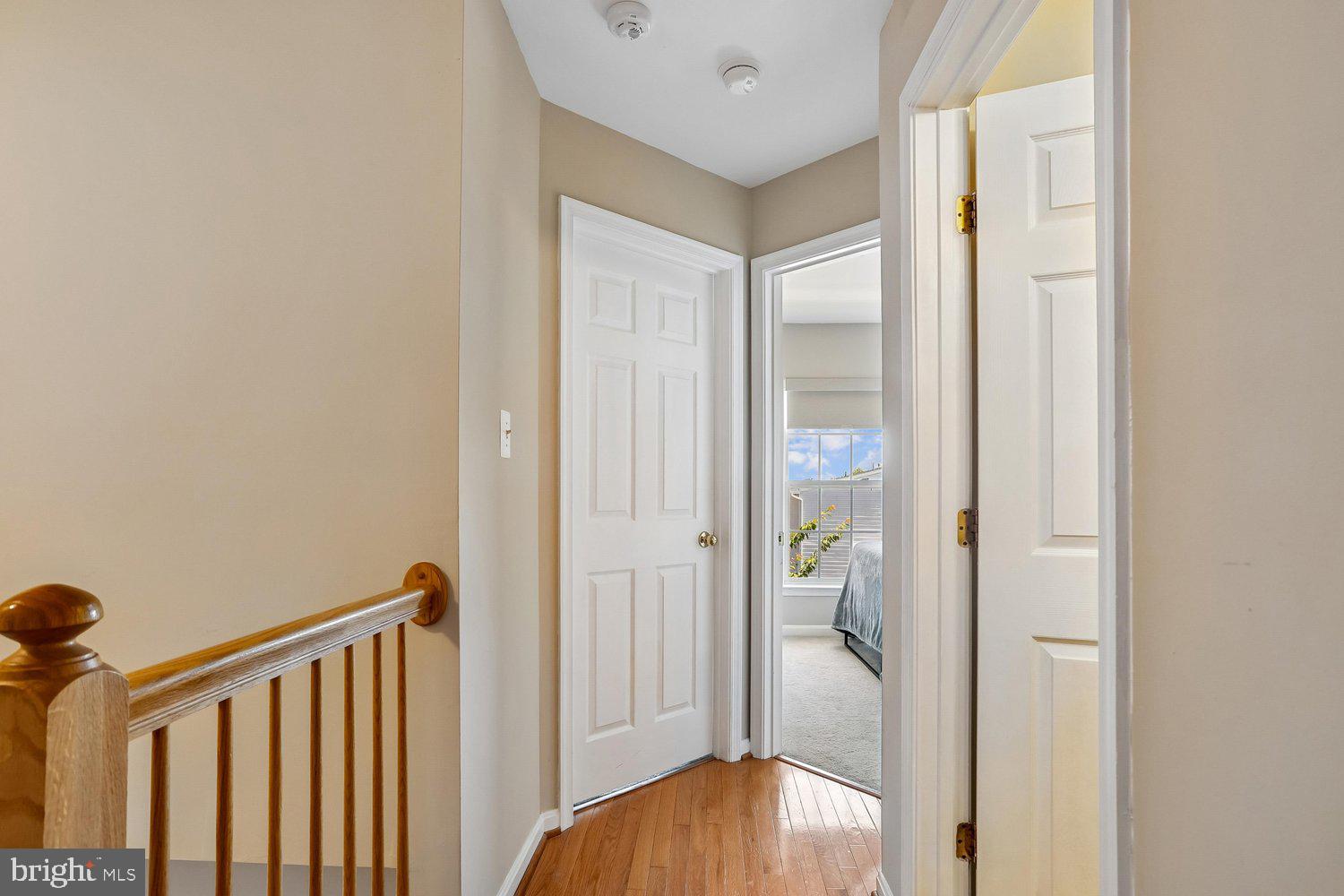 2530 Carrington Way Frederick, MD 21702 - Photo 26 of 38 a view of a hallway with wooden floor and closet