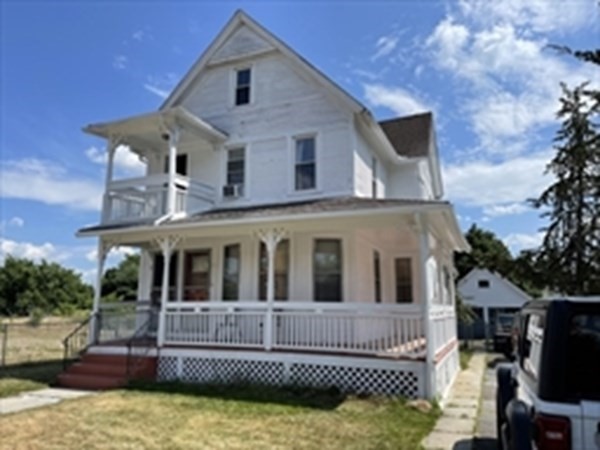 89-91 Ashley Street Springfield, MA 01105 - Photo 1 of 26 a view of a house with a yard