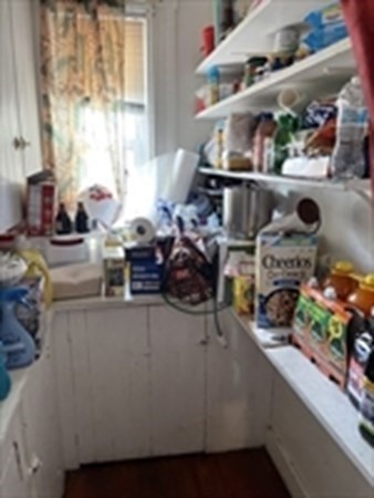89-91 Ashley Street Springfield, MA 01105 - Photo 17 of 26 a room with lots of different colored cloths
