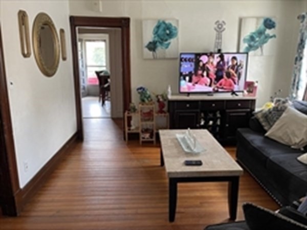 89-91 Ashley Street Springfield, MA 01105 - Photo 21 of 26 a living room with furniture and a flat screen tv