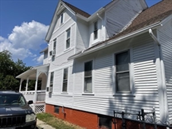 89-91 Ashley Street Springfield, MA 01105 - Photo 5 of 26 a view of a house with a balcony