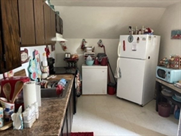 89-91 Ashley Street Springfield, MA 01105 - Photo 7 of 26 a utility room with fridge and washer