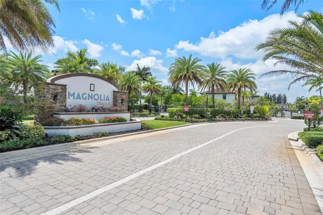 a view of a street with a building in the background
