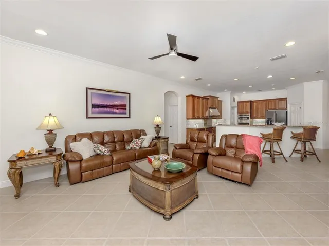 a view of a livingroom with furniture wooden floor and a window