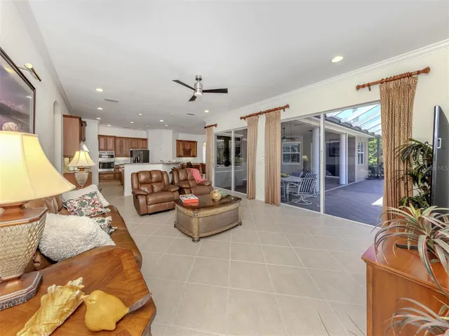 a bathroom with a granite countertop sink a large mirror and a bathtub