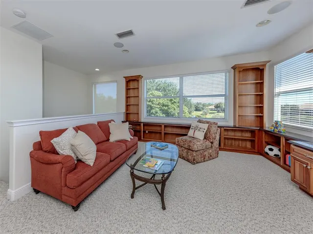 a view of a lake with houses in the back