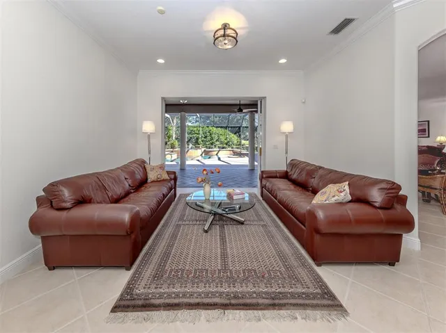 a kitchen with stainless steel appliances granite countertop a refrigerator a stove a sink and a oven